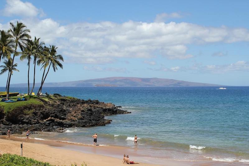 Views the other islands with lava rock and the beach